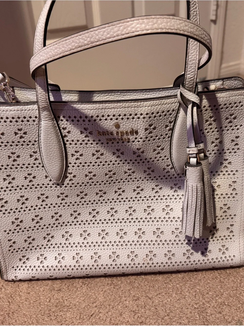 kate spade cream perforated leather tote with tassel